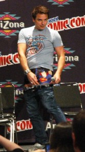 John shows off his Superman underwear. 